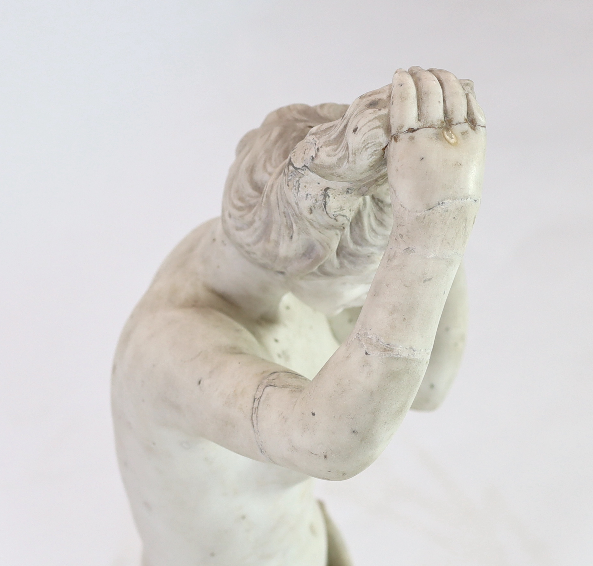 After the Antique. A late 19th century Italian carved white marble figure of Venus Anadyomene